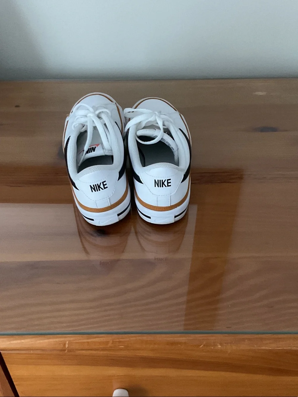 Nike White Leather Sneakers with Black Swoosh and Tan Trim
